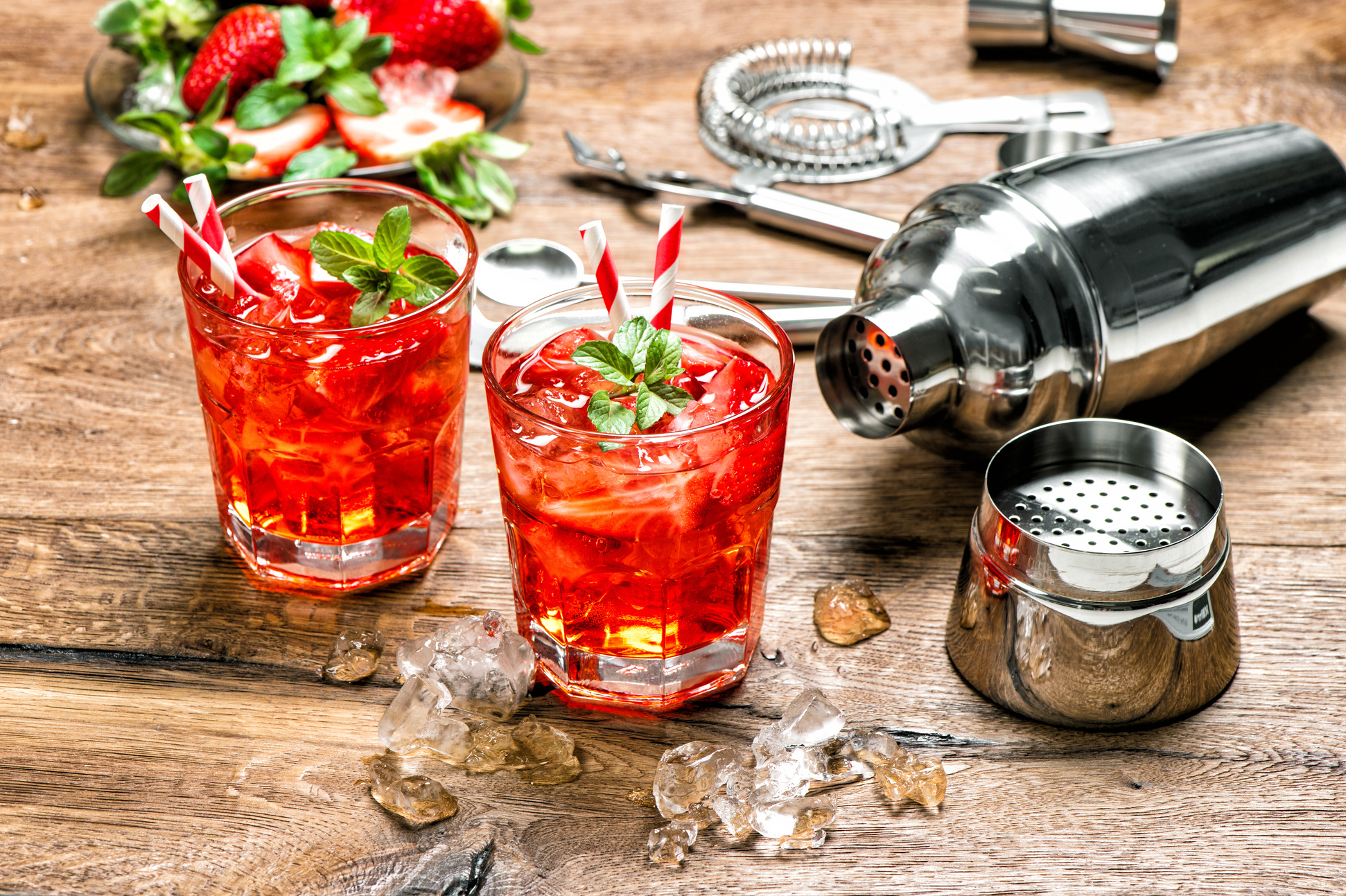 Cocktail making bar tools Red drink with ice